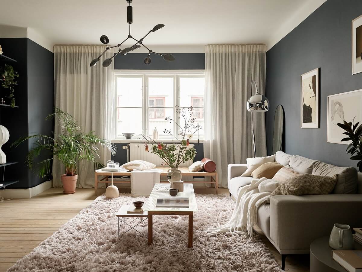 open plan living room dark walls light furnishings