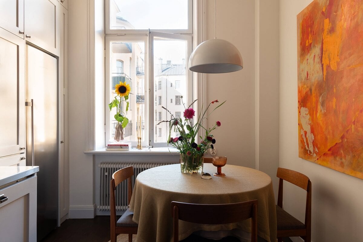 A Beautiful Turn-of-the-Century Apartment with Bold Color Accents 13 round kitchen table