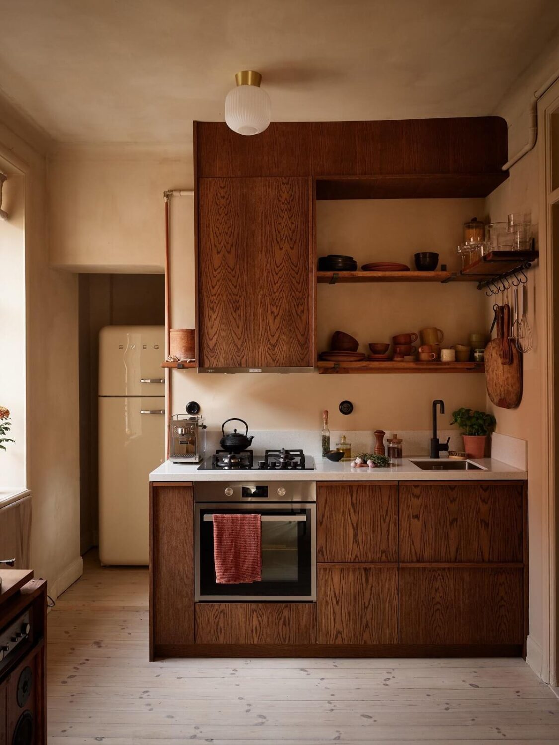 small kitchen with walnut cabinets and shelves nordroom