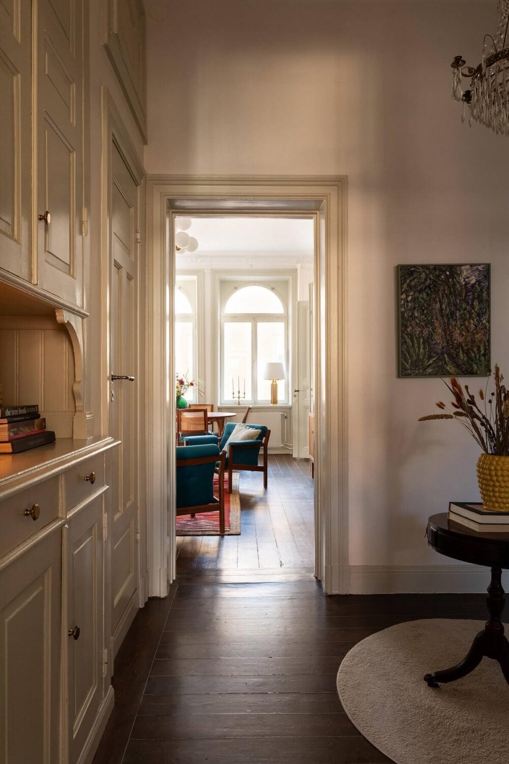 A Beautiful Turn-of-the-Century Apartment with Bold Color Accents 9 spacious hallway with original built in cabinets