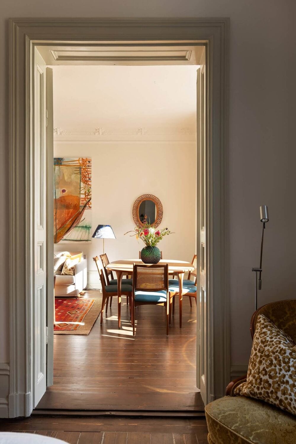 A Beautiful Turn-of-the-Century Apartment with Bold Color Accents 25 view into living room