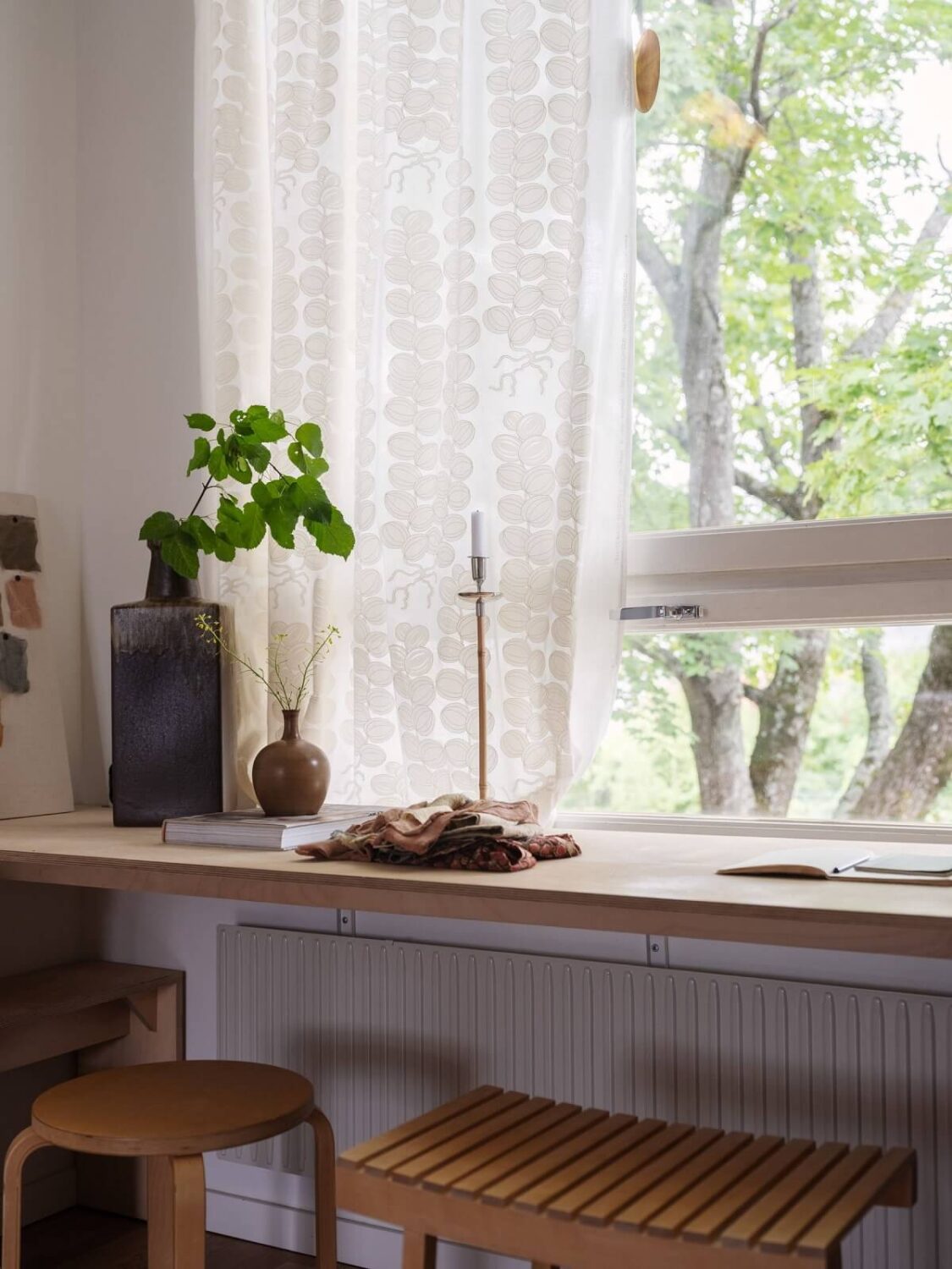 wooden desk under window