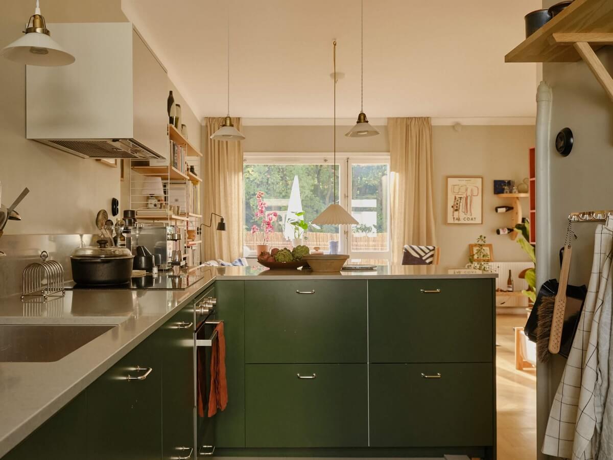 green kitchen open plan living space