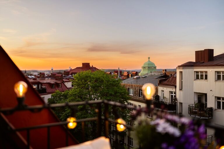 Image showcasing A Swedish Attic Apartment with a Lovely Balcony Overlooking the City ...