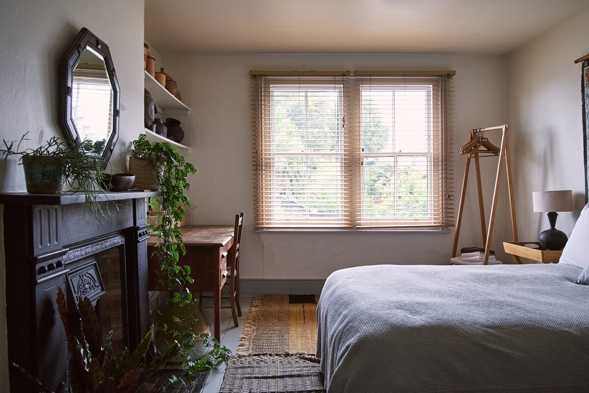bedroom with black fireplace desk