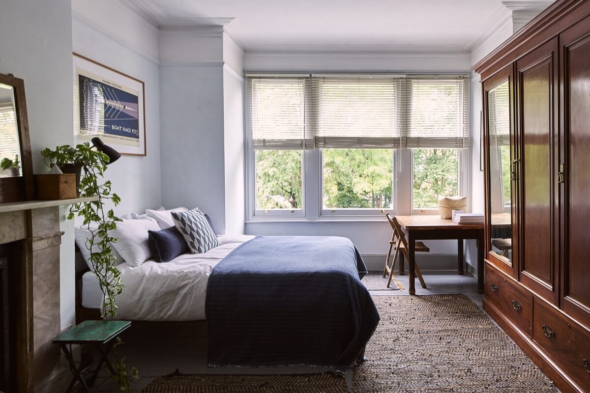 bedroom with large wooden wardrobes