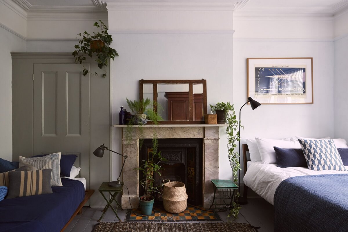 bedroom with seating area and fireplace
