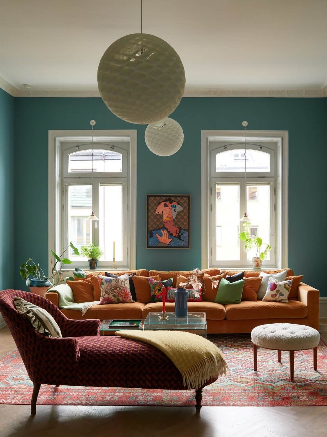 colorful furniture and daybed in blue living room