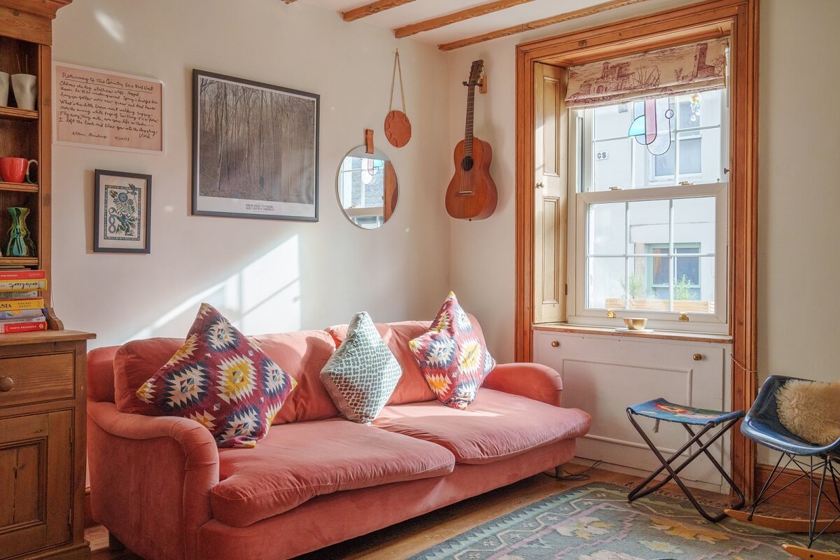 cottage living room with pink couch