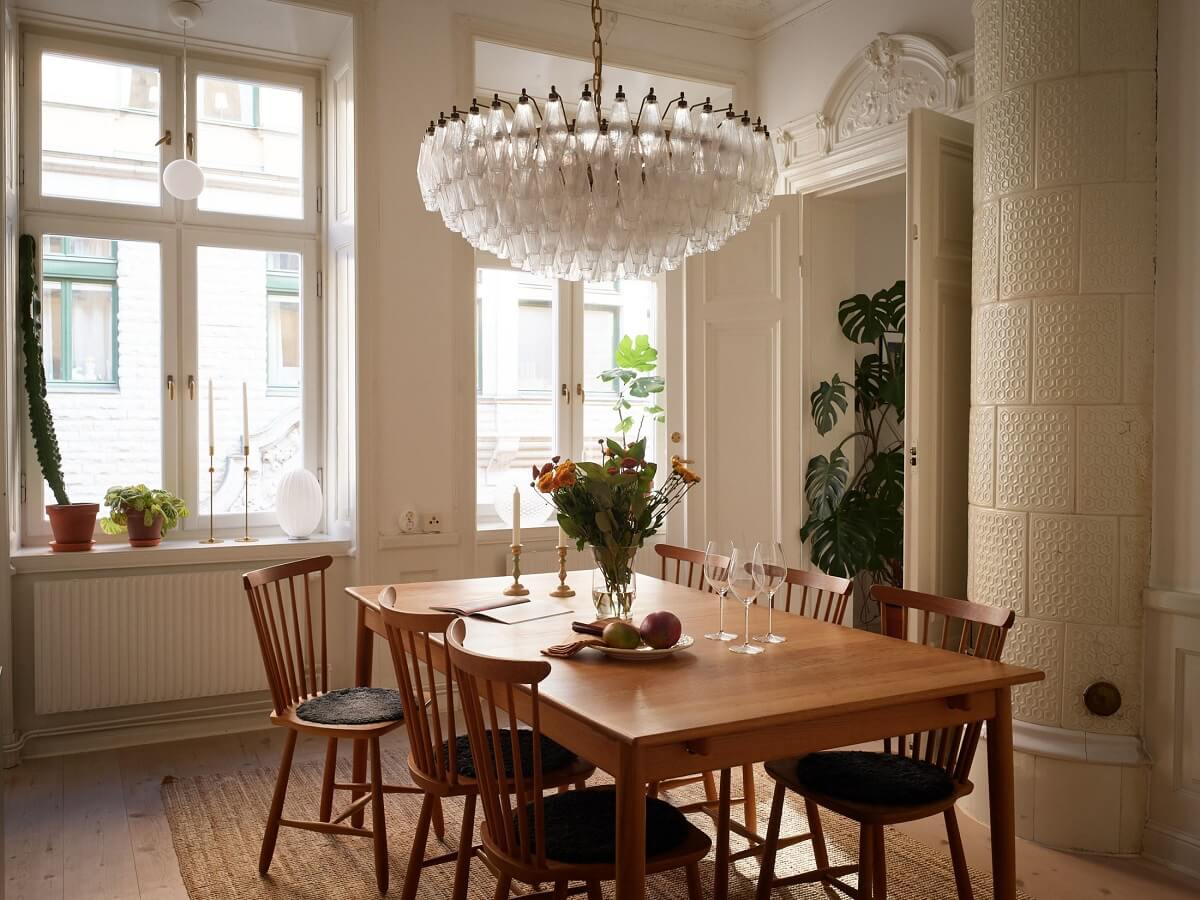 dining room with two large windows A Light Corner Apartment with 1890s Period Features