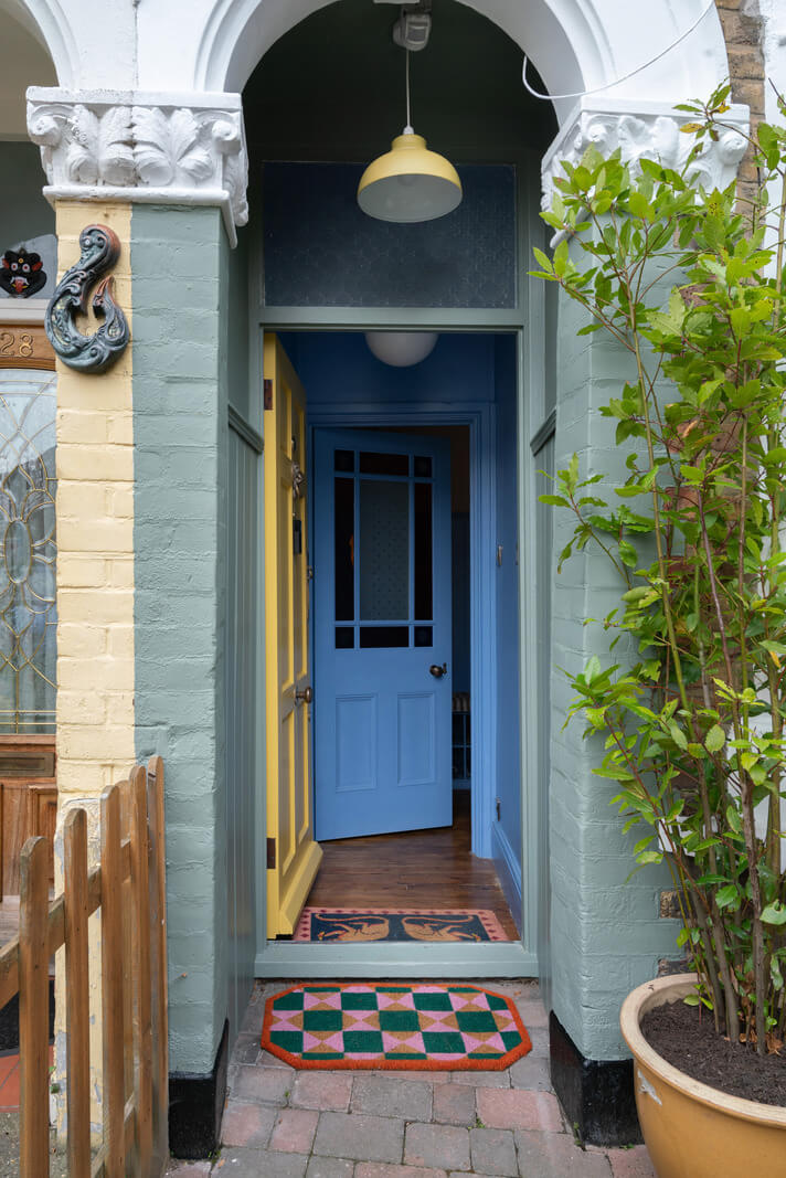 entry yellow door blue hallway Colorful Rooms and Period Features in a London Terrace House