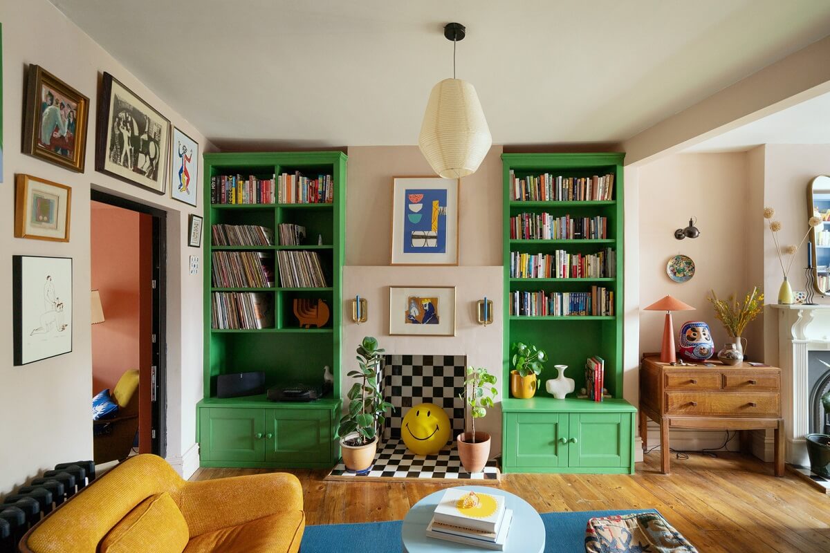 green bookshelves colorful living room