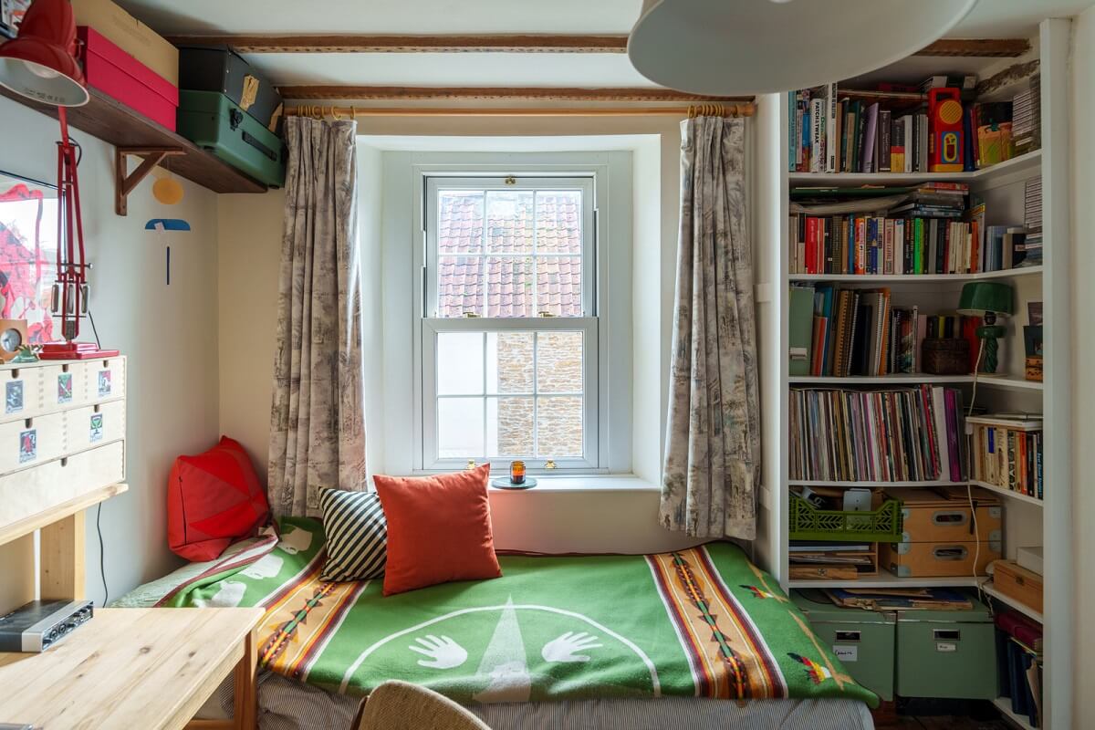 guest room with bookshelves