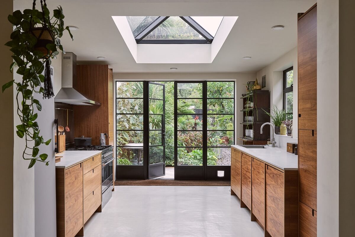 kitchen extension with skylight wooden cabinets