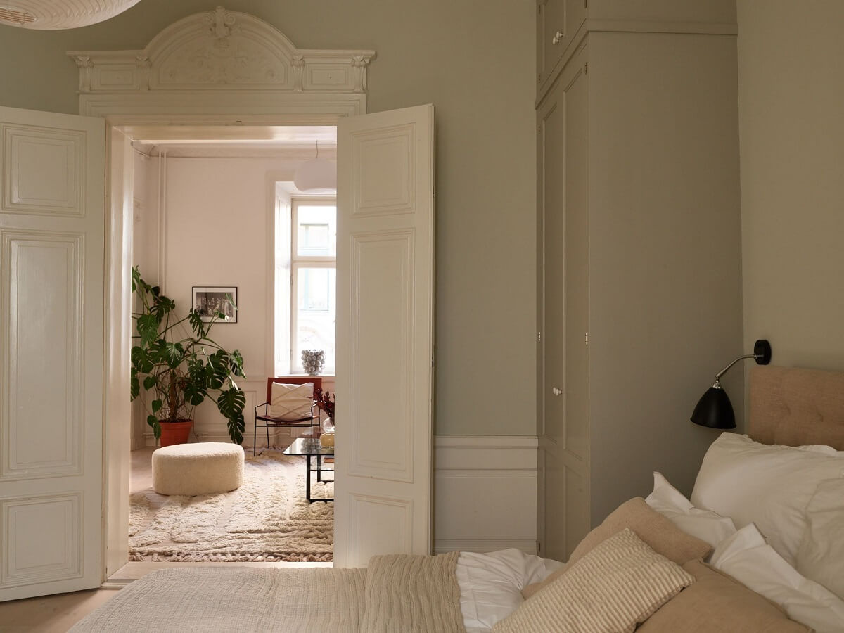 light gray bedroom with double doors