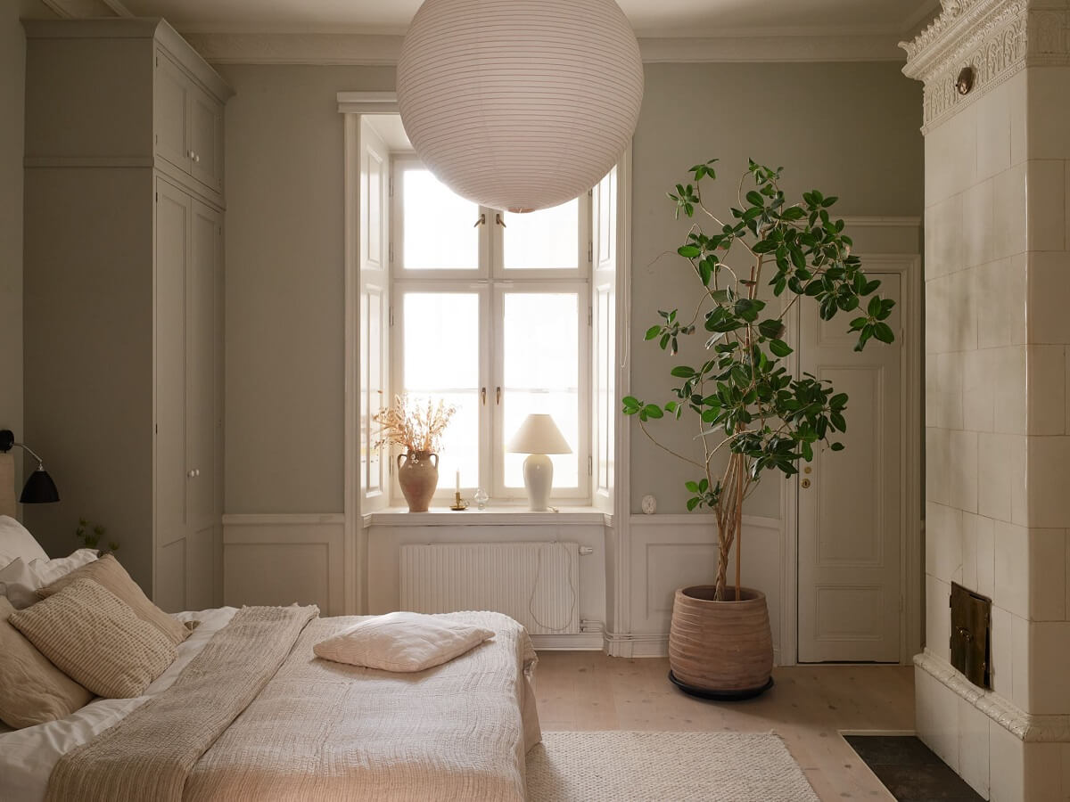 light gray bedroom with fireplace