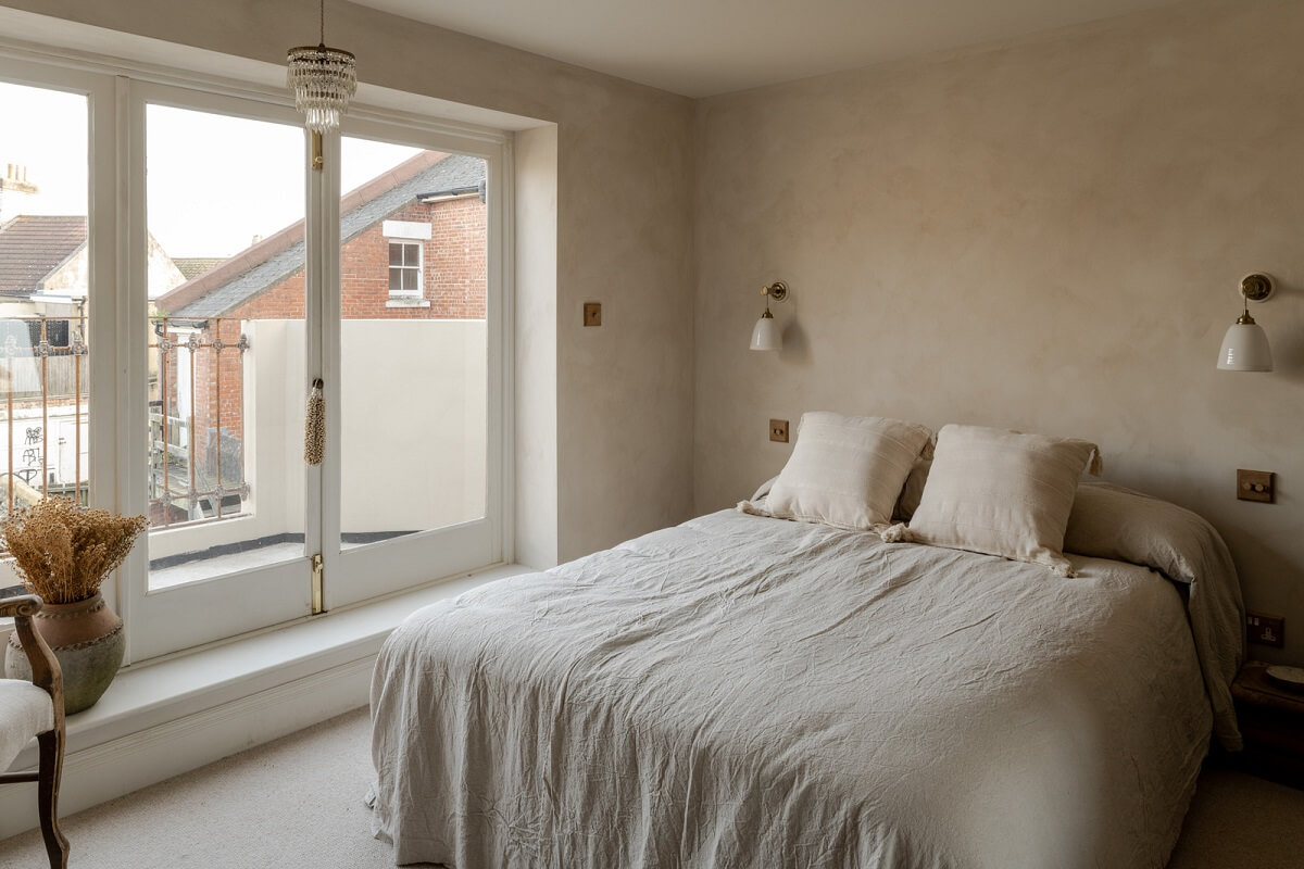 light limewash bedroom with balcony