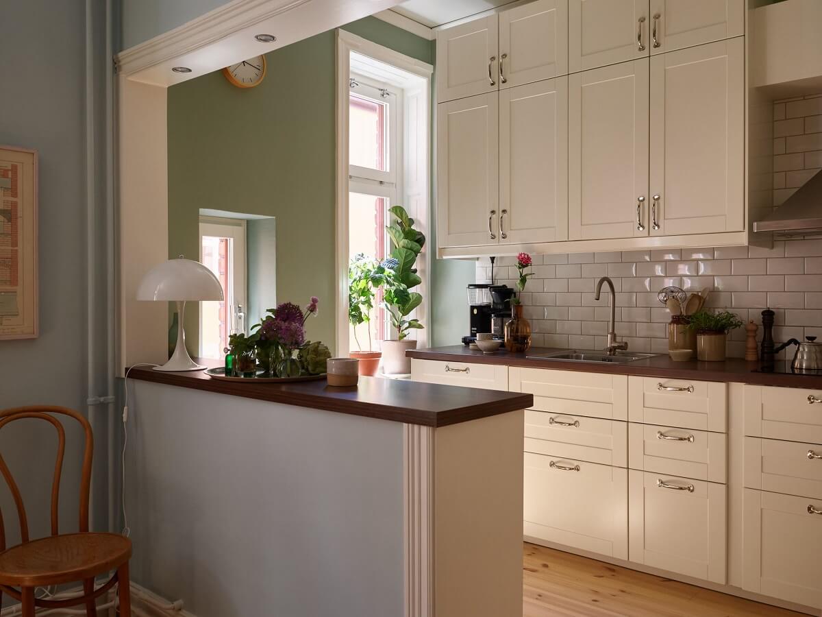 open kitchen with green walls