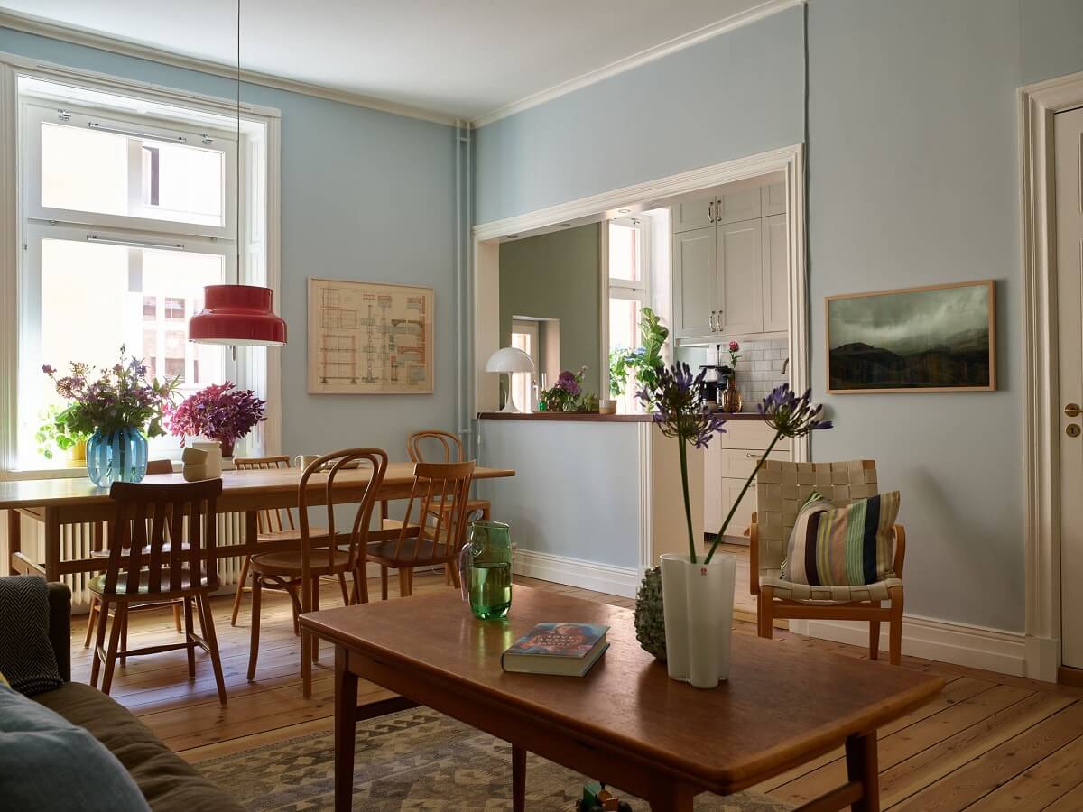 open living room light blue walls midcentury table