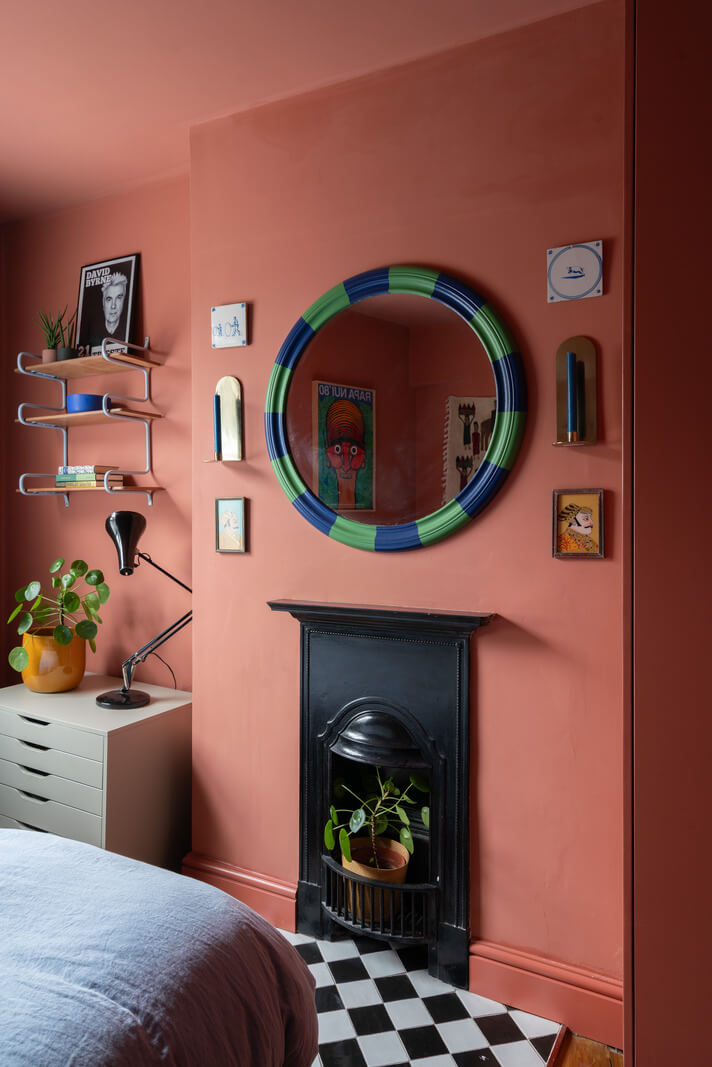 pink bedroom black fireplace checkerboard tiles