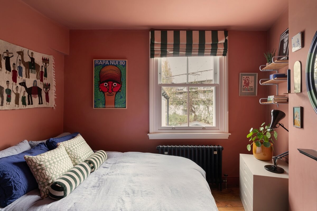 pink color drenched bedroom striped curtain
