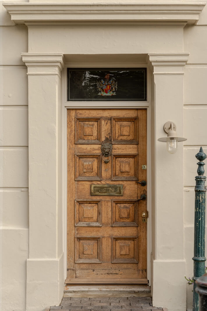 rustic wooden front door Limewash Walls and Restored Period Features in a Calm English Home