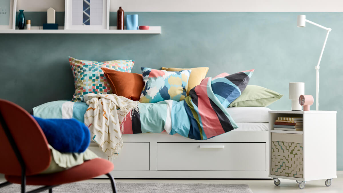 single storage bed with colorful bedding