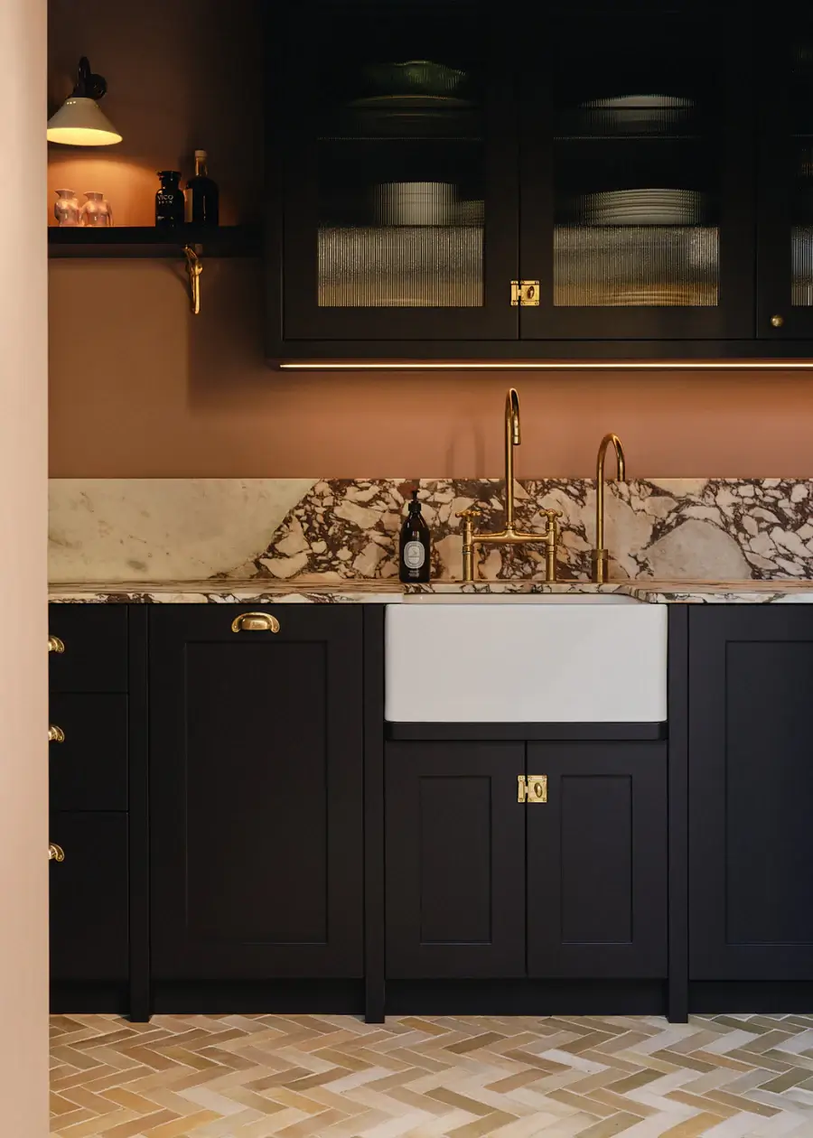 black kitchen with brown wall nordroom Pantone Color of the Year 2025: Mocha Mousse Interior Inspiration
