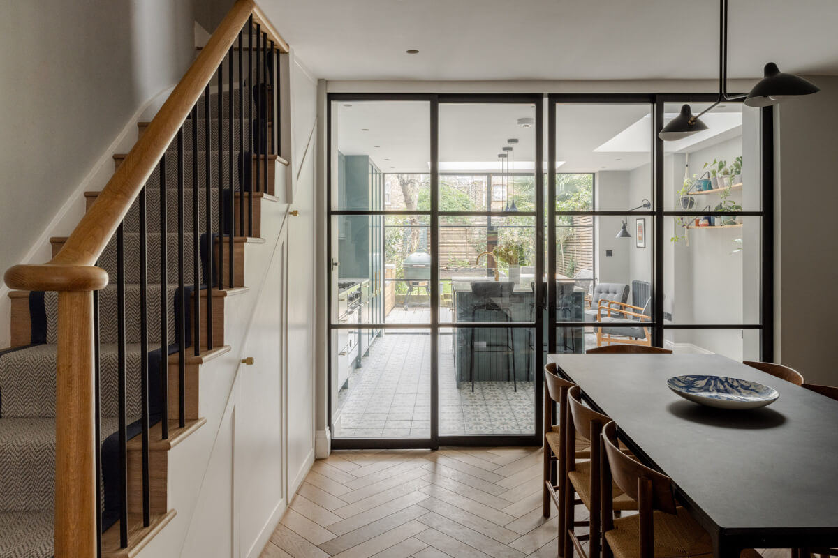 dining room with steel glass doors to the kitchen nordroom