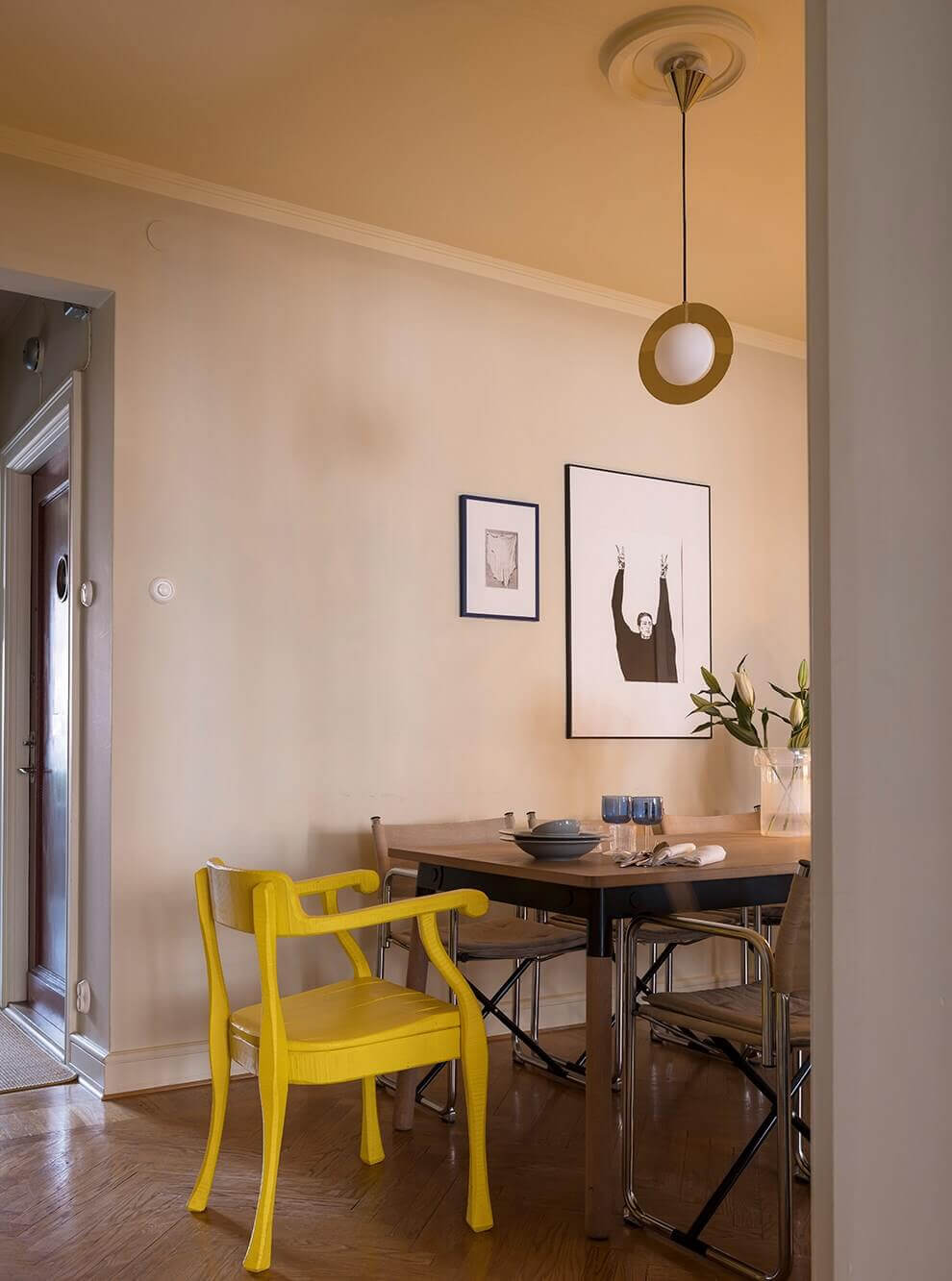 dining room with yellow chair