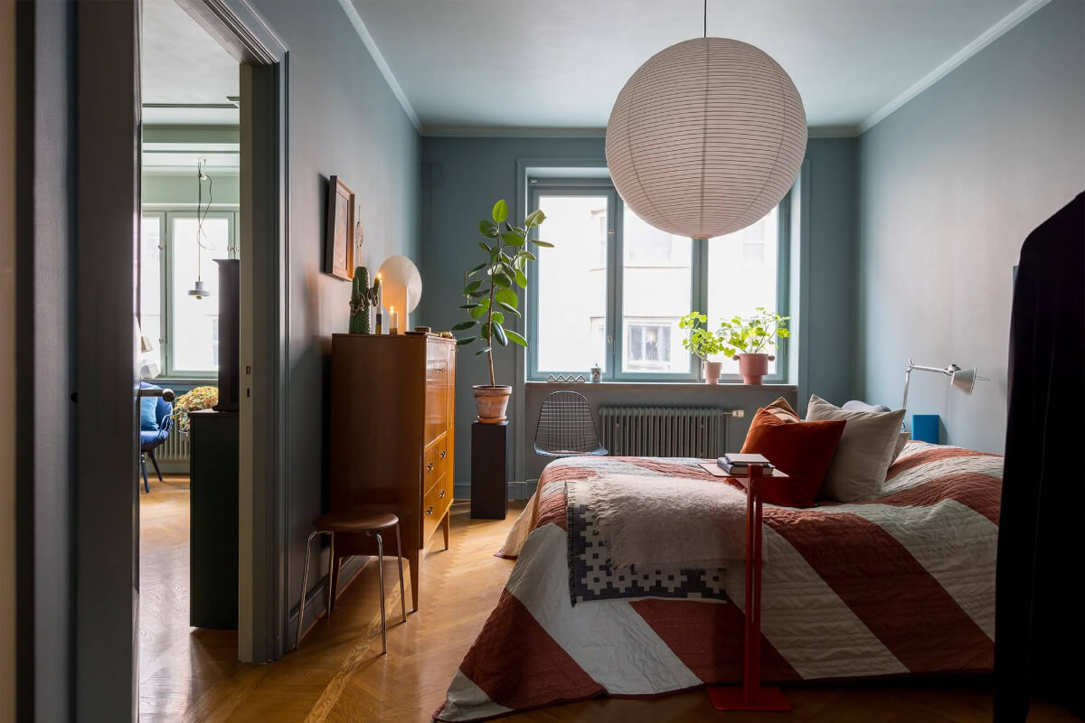 muted blue bedroom with wooden floor
