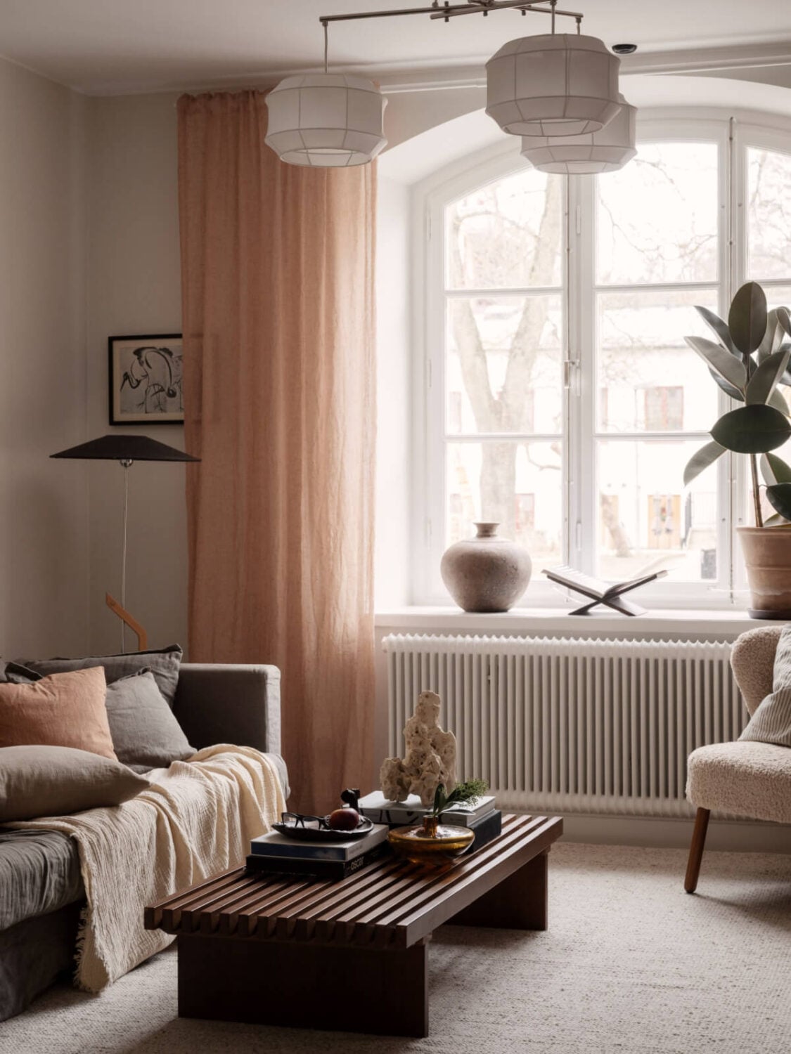 A Calm and Contemporary Apartment in a Former Office Space 2 scandi living room with light terracotta curtains