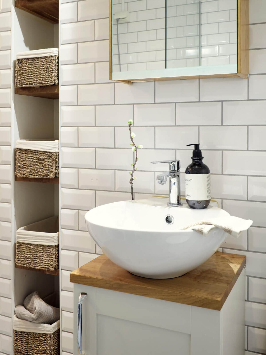 A Light Scandi Apartment in a Former Stately Home 22 bathroom sink tiny storage niche with baskets