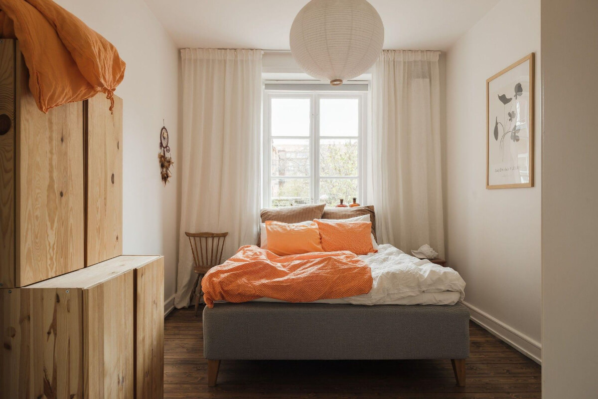 Natural Tones and Original Elements in a 1930s Apartment 12 bedroom dark stained floorboards