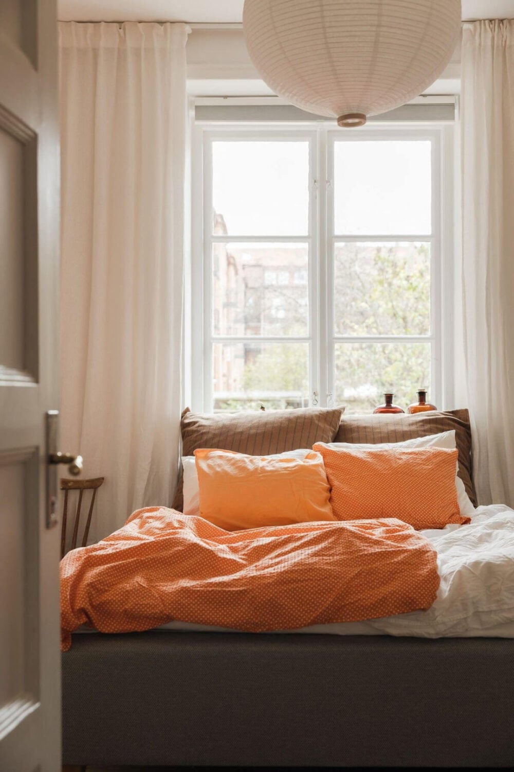 Natural Tones and Original Elements in a 1930s Apartment 11 bedroom earthy textiles