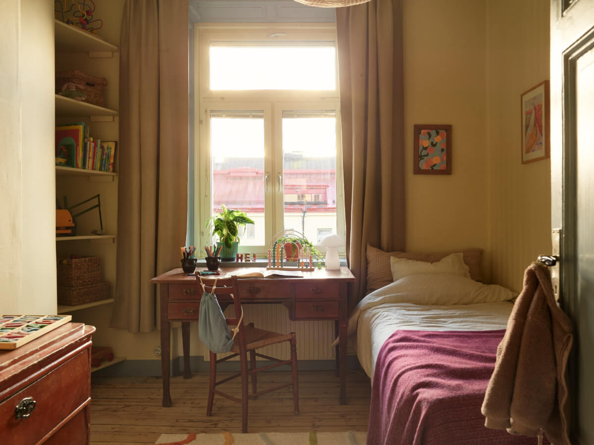 bedroom with antique wooden desk and bookshelves