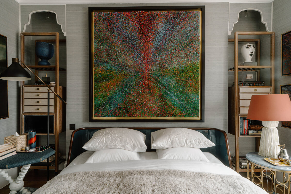 bedroom with large art work above the bed