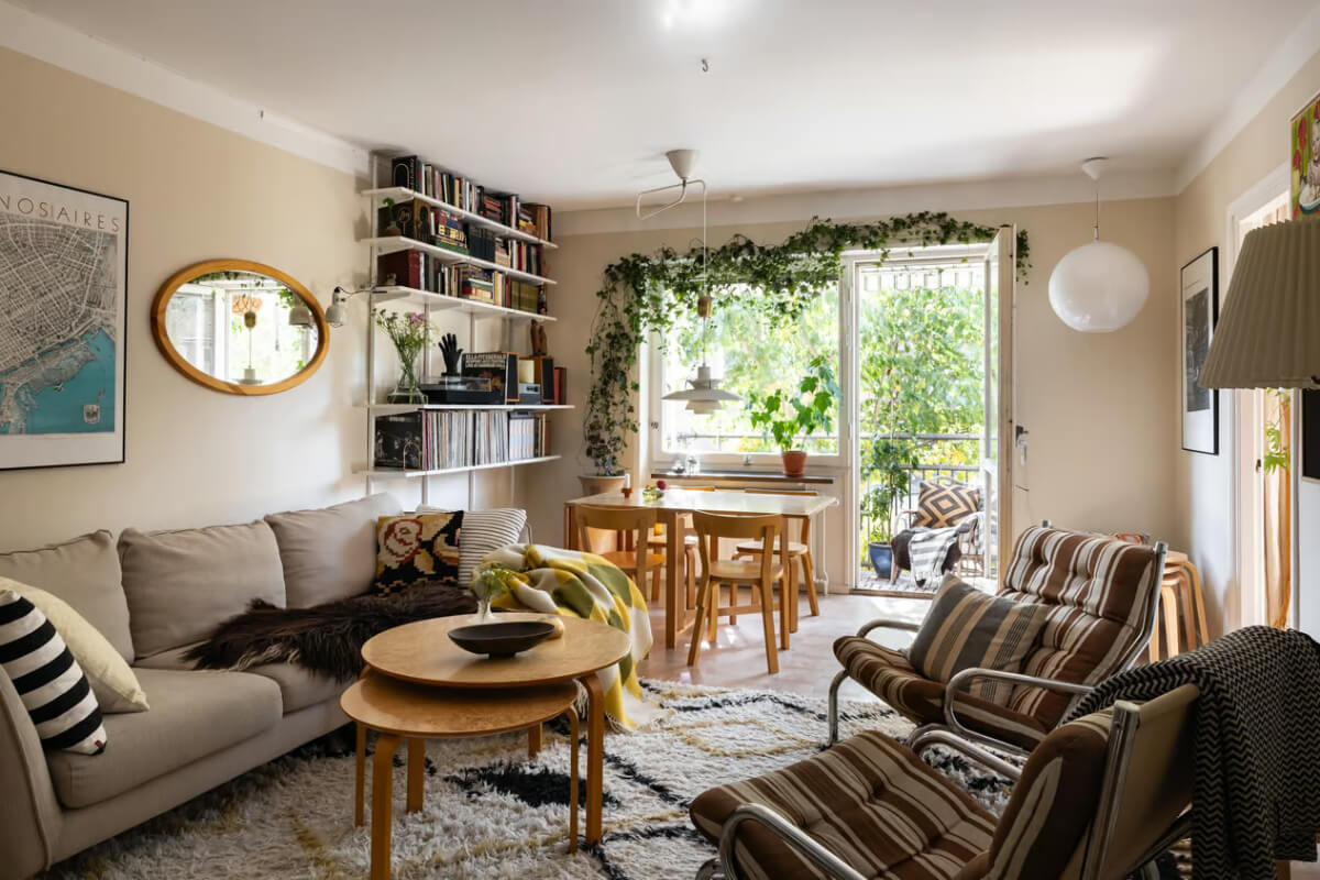 A Cozy Swedish Apartment in a 1950s Building 3 beige living room with balcony