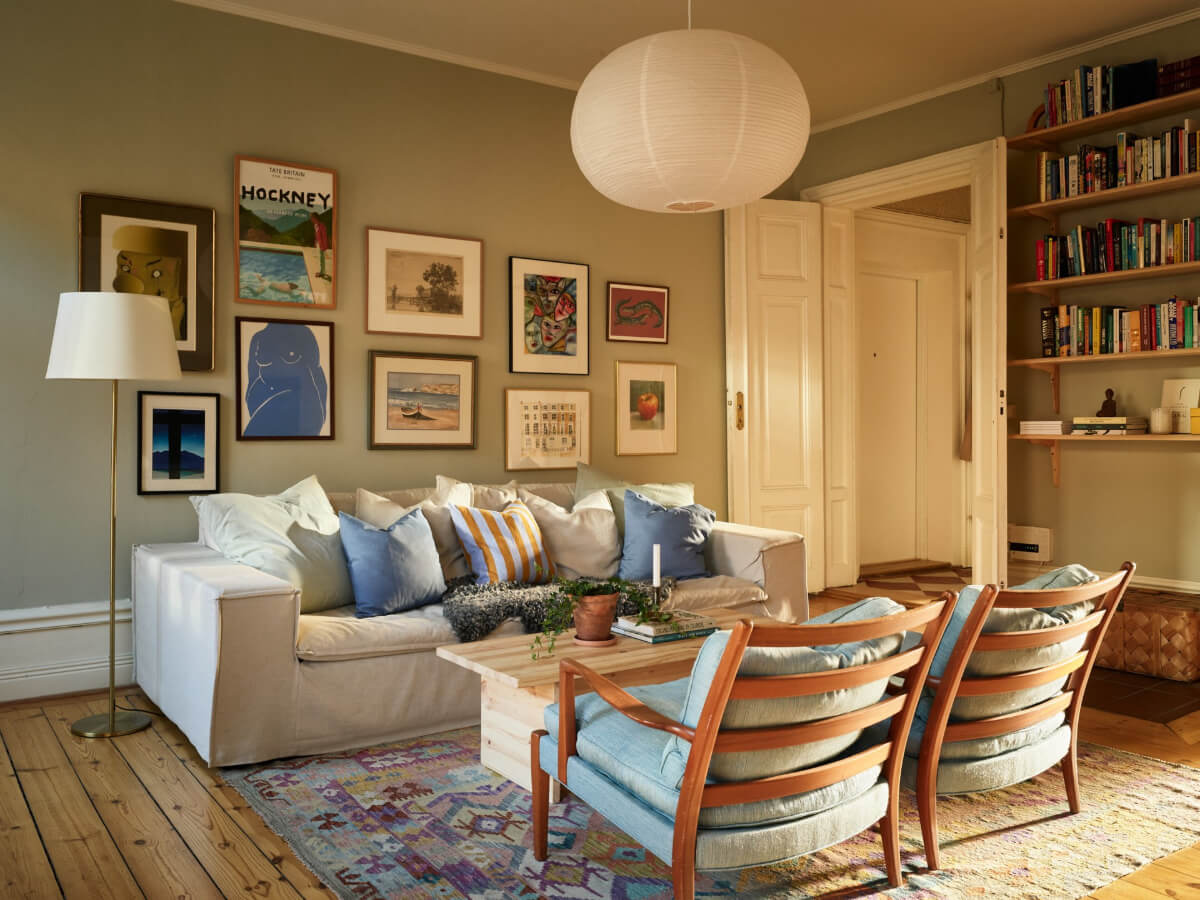 calm living room gallery wall bookshelves