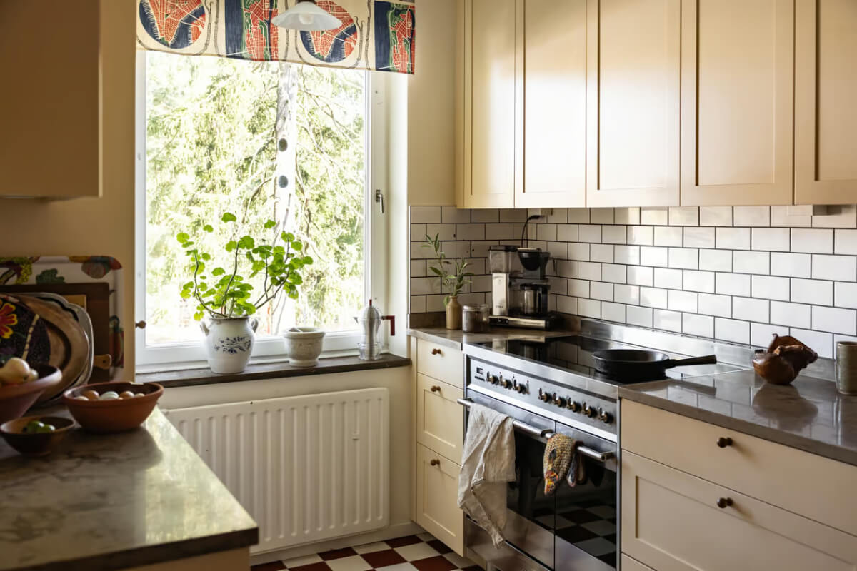 A Cozy Swedish Apartment in a 1950s Building 11 classic kitchen beige cabinets subway tiles