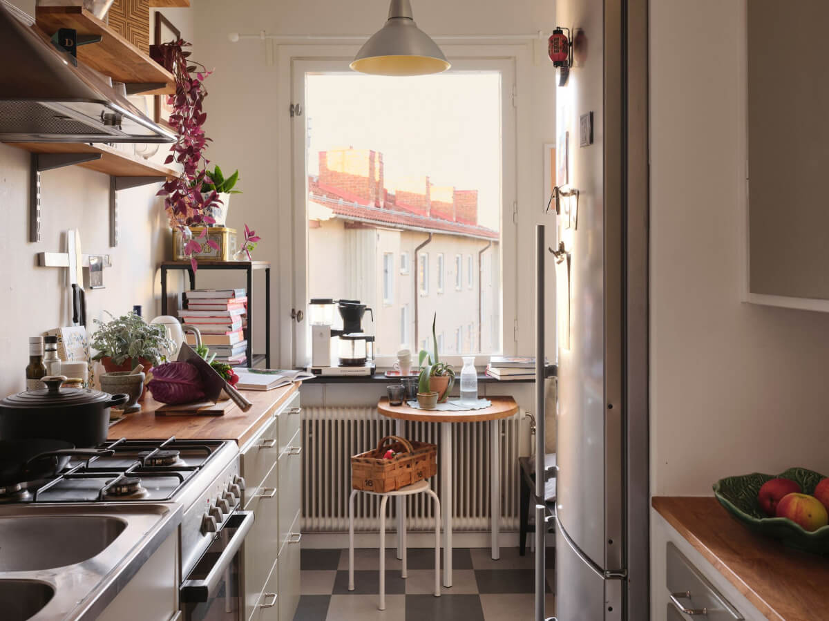 A Small, Light Swedish Apartment with Midcentury Features 12 cozy kitchen checkerboard floor and small table