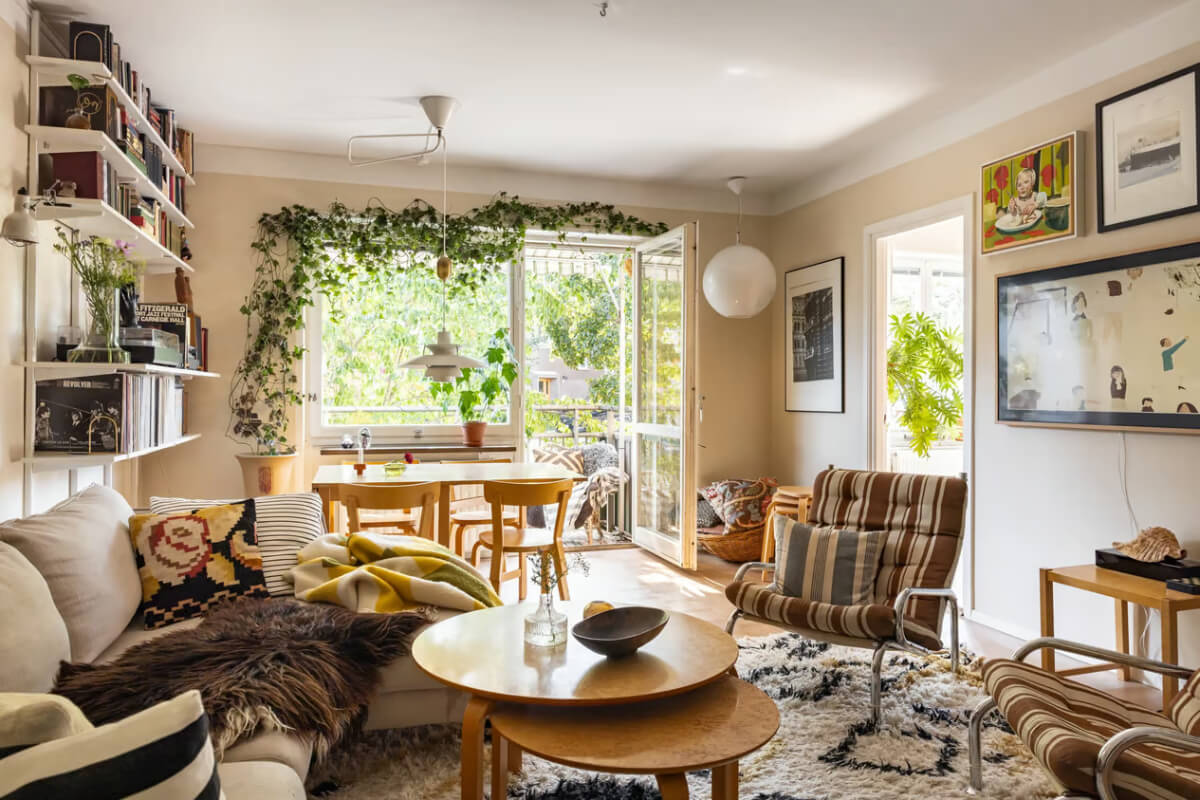 A Cozy Swedish Apartment in a 1950s Building 2 cozy living room large rug beige walls
