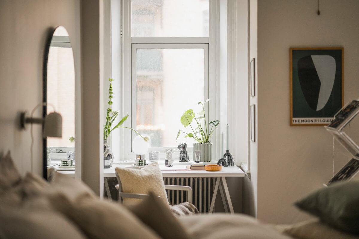 An Early 20th-Century Apartment with a Pink Kitchen 12 desk under window