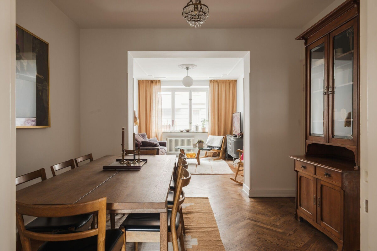 Natural Tones and Original Elements in a 1930s Apartment 4 dining room large wooden table