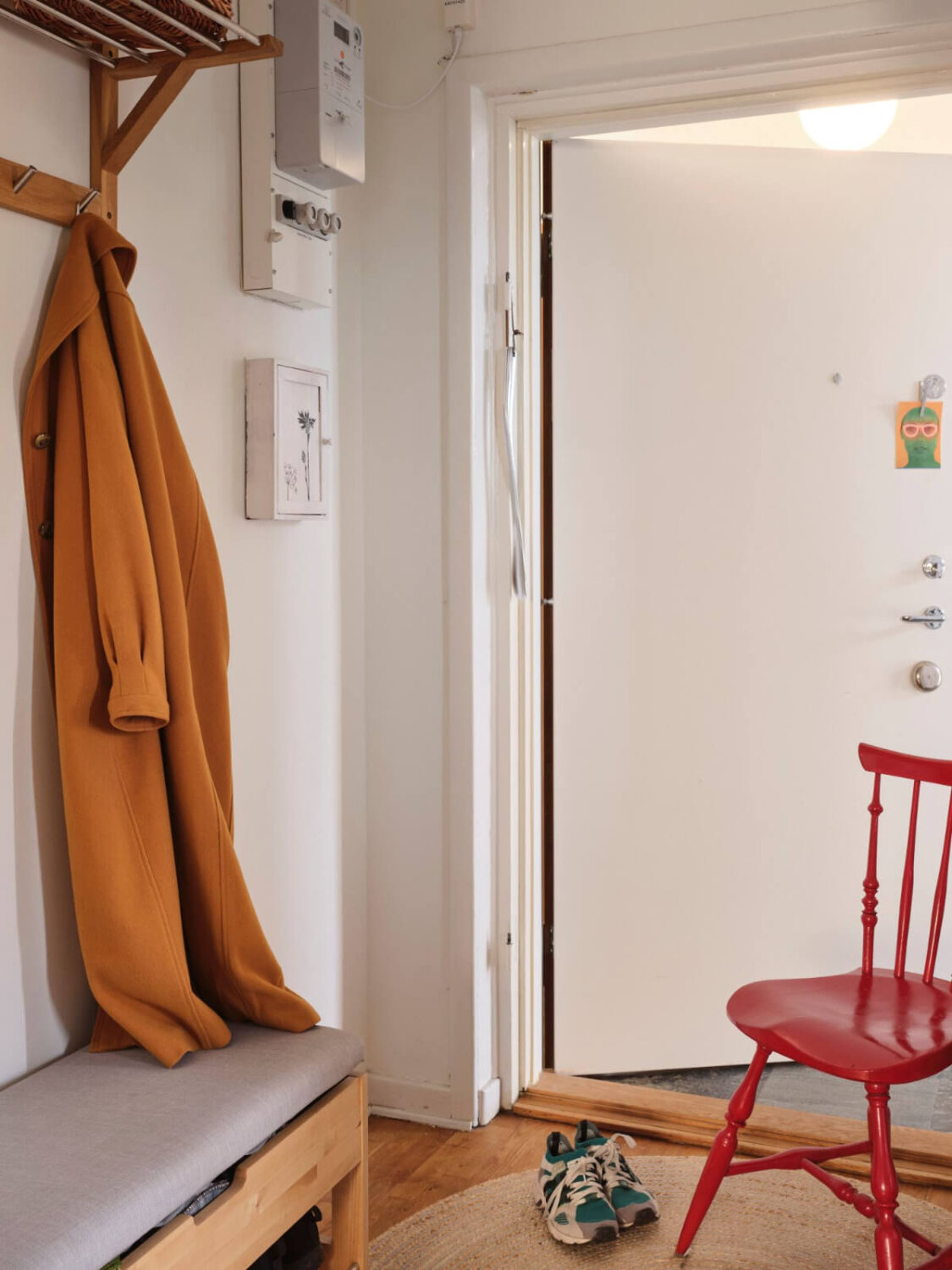 A Small, Light Swedish Apartment with Midcentury Features 22 entry with storage bench A Small, Light Swedish Apartment with Midcentury Features