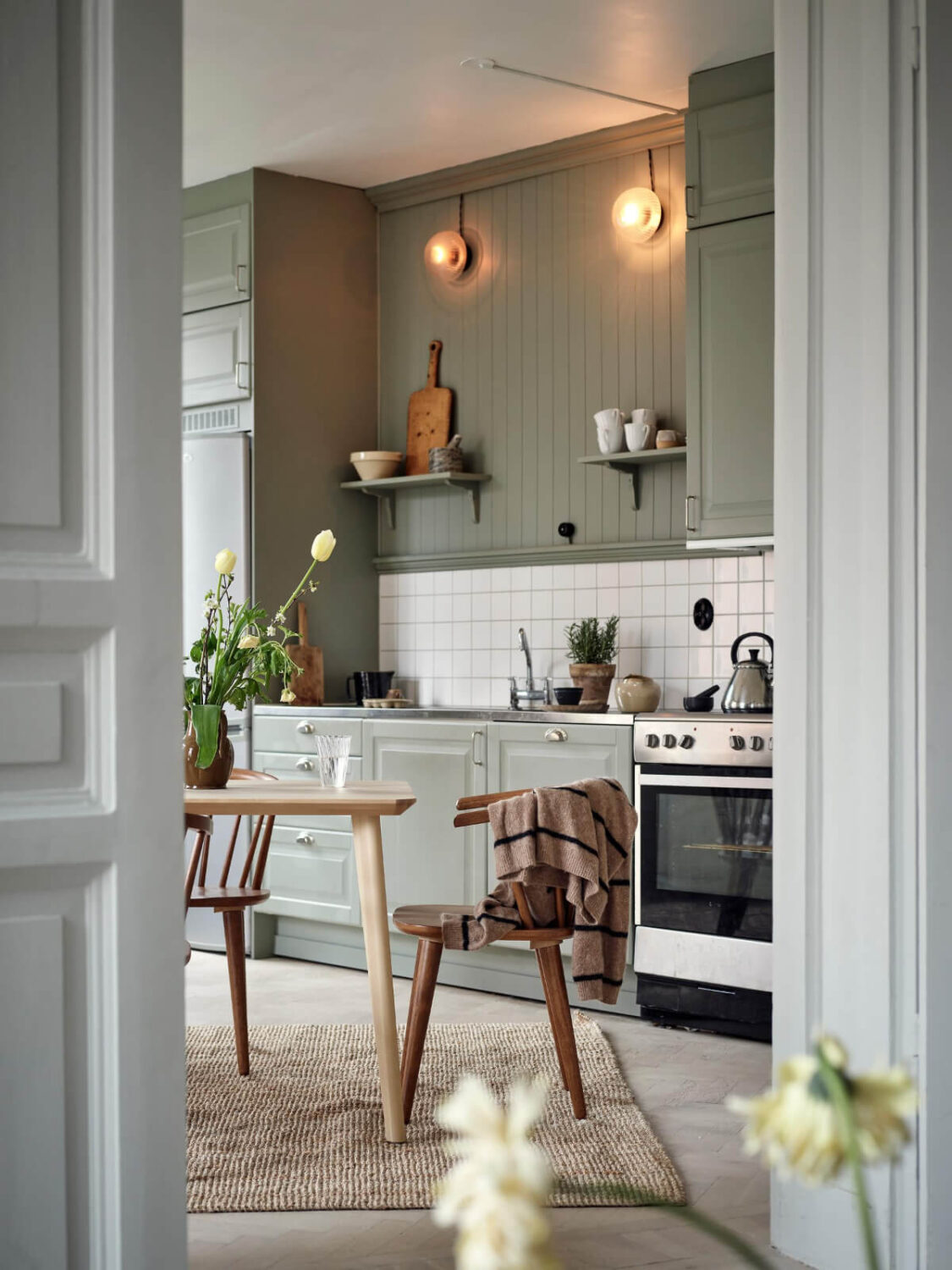 A Light Scandi Apartment in a Former Stately Home 8 gray-green kitchen wall paneling