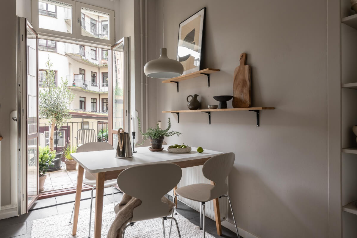 gray kitchen with balcony A Serene Studio Apartment with a Loft Bed and a Large Balcony