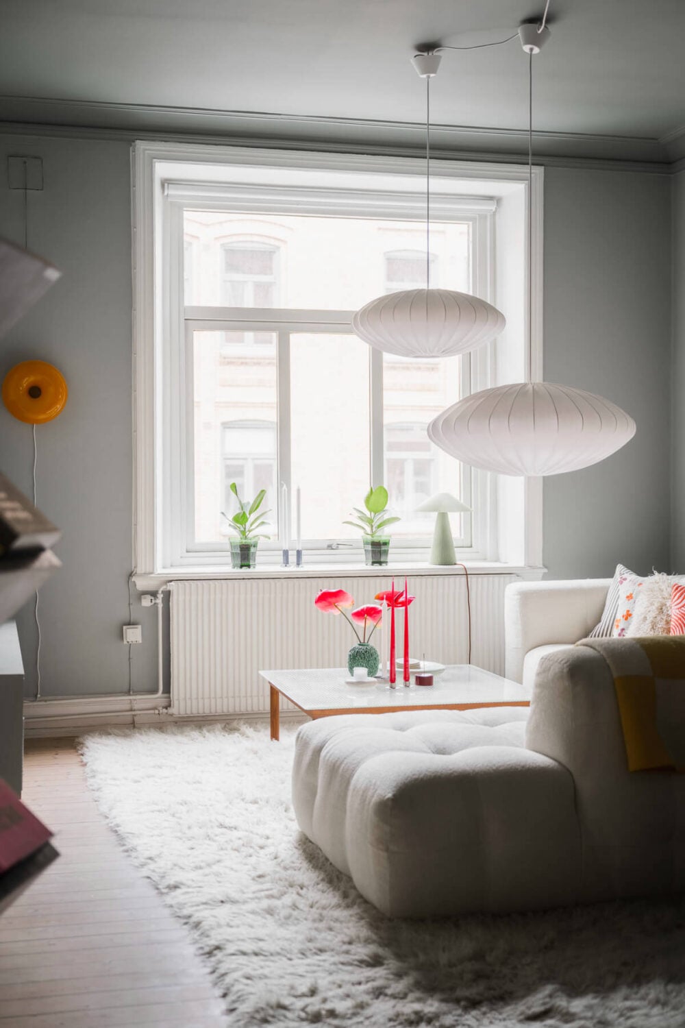 An Early 20th-Century Apartment with a Pink Kitchen 5 gray living room large window