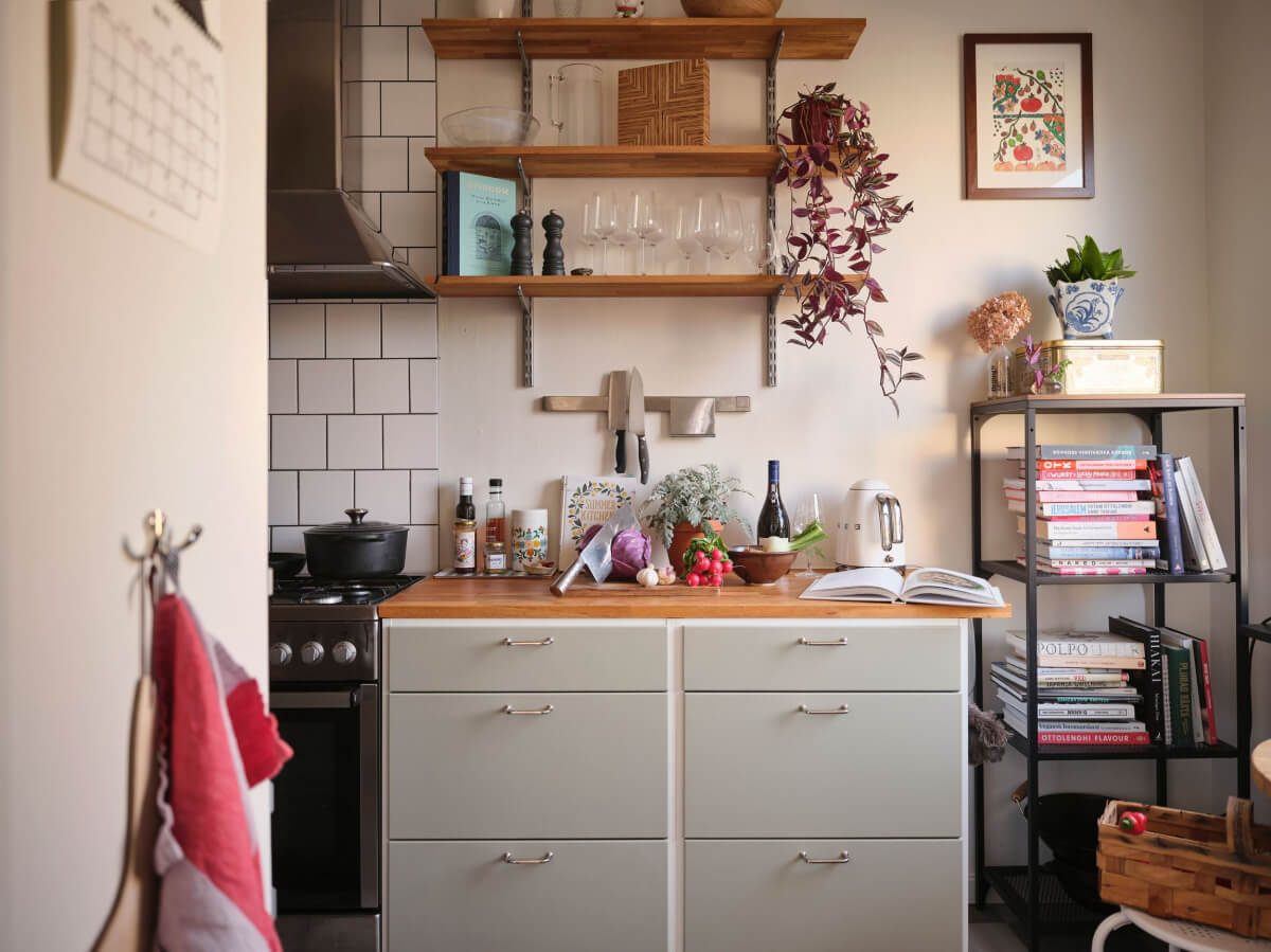 A Small, Light Swedish Apartment with Midcentury Features 14 gray midcentury kitchen with wooden shelves
