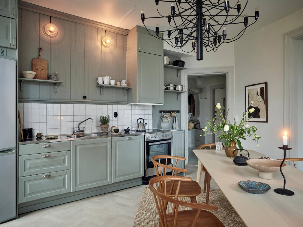 A Light Scandi Apartment in a Former Stately Home 12 green kitchen classic white tiles